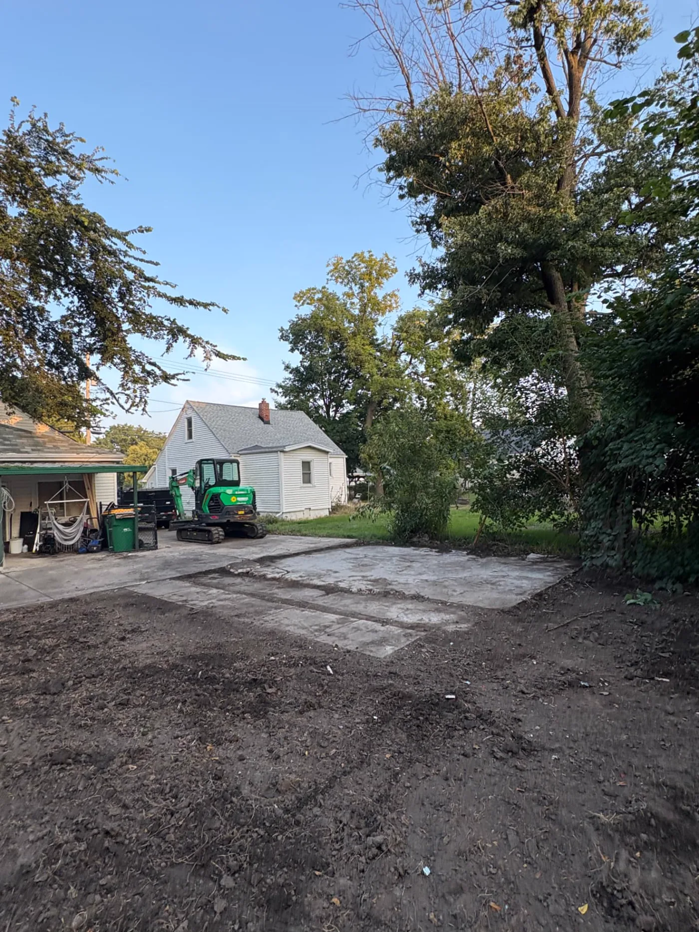 Cleared yard and concrete pad after removal of a detached garage