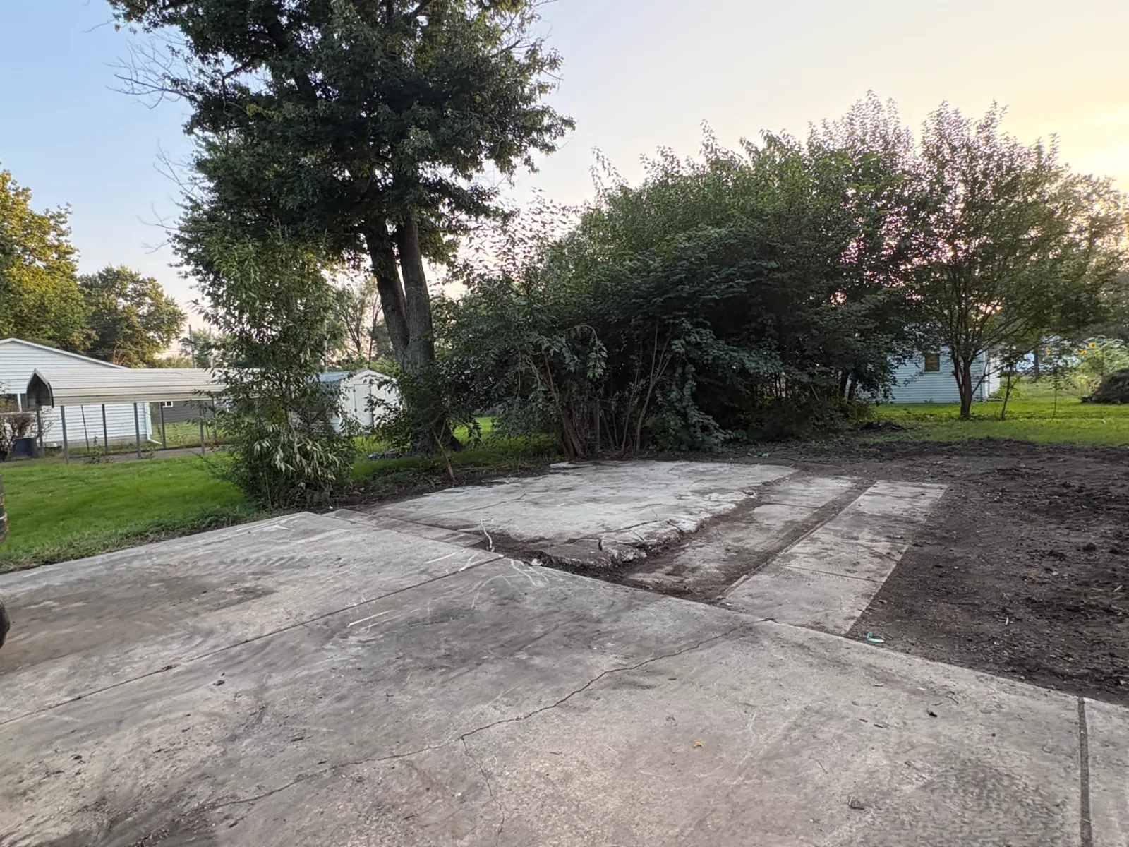 Cleared concrete pad and driveway after garage demolition was completed