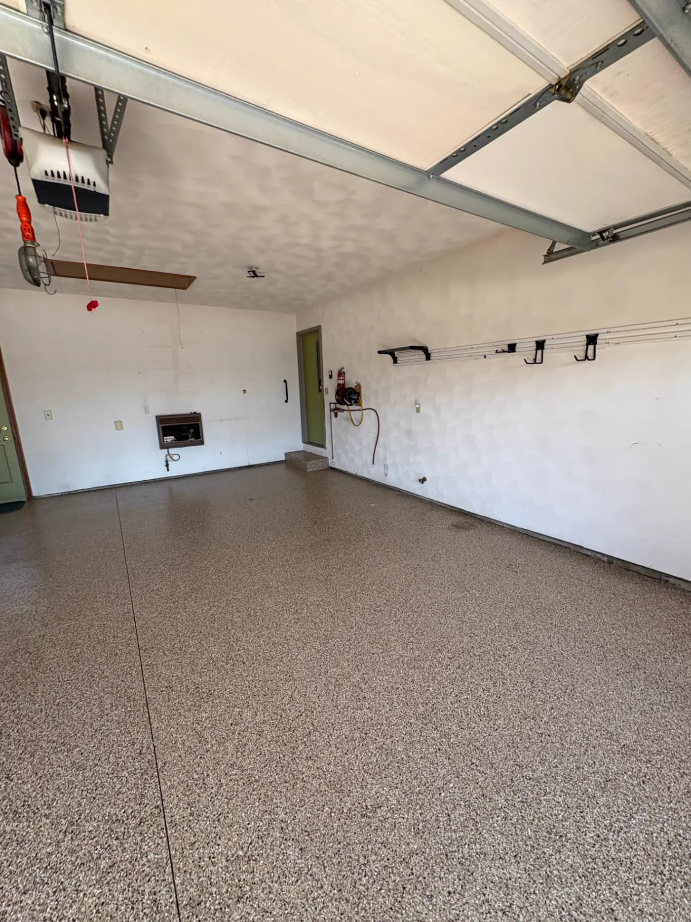 Residential garage pickup after removal Cleared garage floor after TrashDash completed a residential pickup